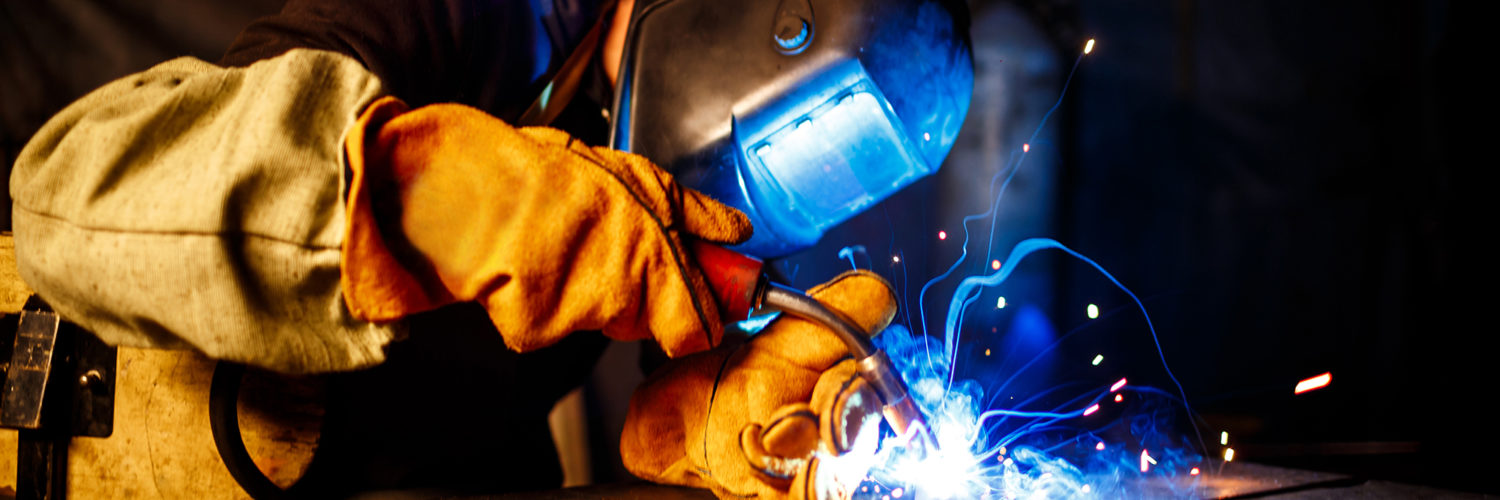 Cutting metal with plasma equipment on plant. Worker cutting metal with plasma equipment. on plant